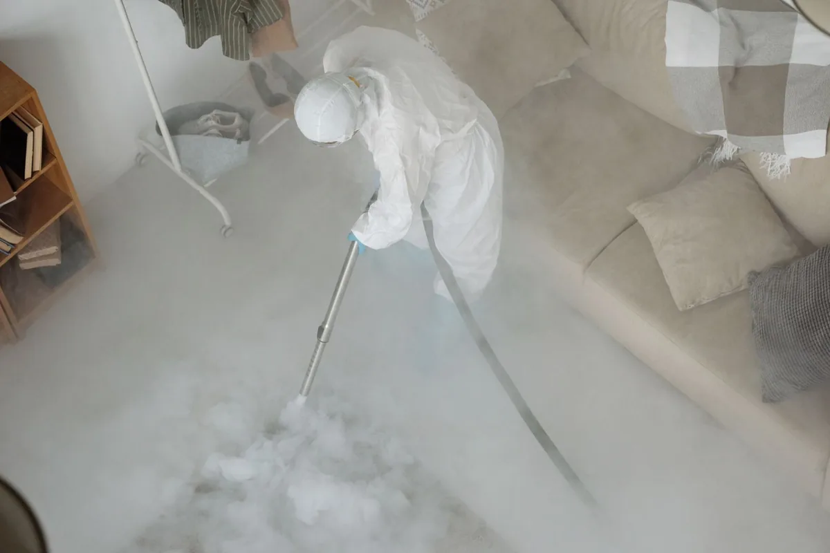 Biohazard cleanup technician in protective equipment, Fayetteville, NY